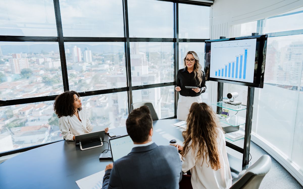 Woman presenting statistics to her team